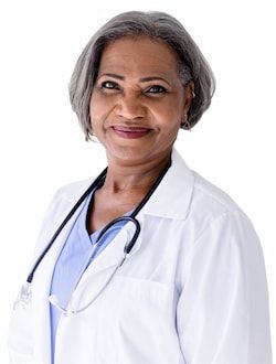 Female nurse with stethoscope smiling.