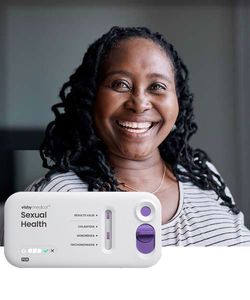 Patient smiling with Visby Medical Sexual Health device.