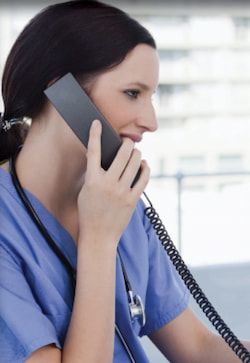 Female nurse on the telephone.